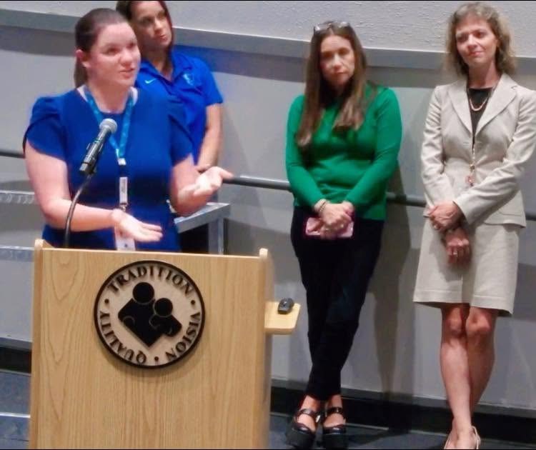 Meredith Westfall speaking at a district event